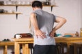 Back pain, kidney inflammation, man suffering from backache