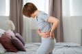 Back pain, kidney inflammation, woman suffering from backache at home Royalty Free Stock Photo