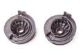 Back of pair of metal attachments for undercarriage springs in black on white background is isolated in photo studio for sale at