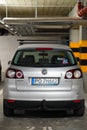 Back of a parked silver colored Volkswagen Golf Plus in a parking