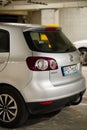 Back of a parked silver colored Volkswagen Golf Plus in a parking