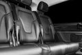 Back passenger seats in modern luxury car. Frontal view. Perforated leather with white stitching. Car detailing. Back Leather comf Royalty Free Stock Photo