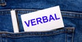 The back pocket of blue jeans contains a white pen and a white card with the text VERBAL Royalty Free Stock Photo