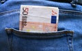 Back pocket with money blue jeans