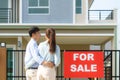 Back portrait of Asian young couple standing and hugging together looking happy in front of their new house to start new life. Royalty Free Stock Photo