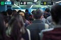 Back portrait crowd of passengers waiting for entering at the entrance of subway station during rush hours in morning