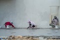 Back portrait group of workers use trowel for flooring the cement surface