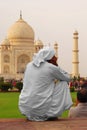 Back portrait of an Indian man looking deeply into the majestic Taj Mahal at Agra, Uttar Pradesh, India Royalty Free Stock Photo