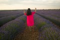 Back portrait of young happy and beautiful woman in Summer dress enjoying nature running free and playful outdoors at purple Royalty Free Stock Photo