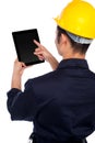 Back pose of worker operating tablet device