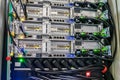 Back of the powerful computer servers installed in the rack. Electrical sockets and network interfaces are  close-up. The Royalty Free Stock Photo