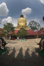 Back of Pra Put Ratanamani Srihathai Naresuan sitting outdoor Buddha in Wat Maniwong temple.