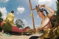 Back of Pra Put Ratanamani Srihathai Naresuan sitting outdoor Buddha in Wat Maniwong temple.