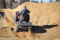 The back of a quader going up a gravel hill Royalty Free Stock Photo