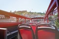 Back of red bus seats with open roof Royalty Free Stock Photo