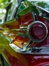 back of retro car from the 60s. Rear wing tail unit of red color retro car