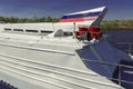 The back of the river pleasure passenger boat. Top tail in the colors of the Russian flag.