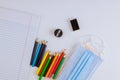 Back school education school supplies stationery equipment on the medical mask COVID-19 pandemic Royalty Free Stock Photo