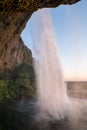 Sunset at the back of Seljalandsfoss waterfall in Iceland Royalty Free Stock Photo