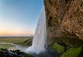 Sunset at the back of Seljalandsfoss waterfall in Iceland Royalty Free Stock Photo