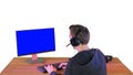 Back shot of competitive young man playing online games on compu Royalty Free Stock Photo