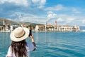 Back shot of Female tourist looking at townscape of beautiful seaside town of Trogir in Croatia Royalty Free Stock Photo