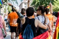 Back shot of a lesbian couple participating in LGBTQ pride march in Bratislava, Slovakia