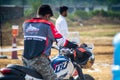 back shot of participant at hero dirt biking challange wearing the protective jacket preparing at the start line as