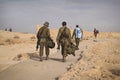 Back shot of several soldiers of israel army walking with israel national flag. Military man walking with other soldiers. War Royalty Free Stock Photo