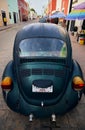 Back shot of a Volkswagen Kaefer vintage car in turquoise color in Valladolid, Yucatan, Mexico