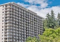 Back side of apartment residential building on blue sky background