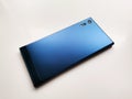 Back side of cobalt blue smartphone on white background