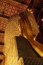 Back side of the golden reclining Buddha statue at the Wat Pho Temple, Bangkok, Thailand Royalty Free Stock Photo