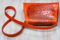 Back side of handmade orange embossed leather bag