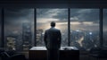 Back side of a hopeful man standing in an office area in front of window