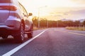 Back side of new silver SUV car parking on the asphalt road Royalty Free Stock Photo