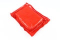 Back side of plastic foil wrap cheese packaging isolated on white background. Red square shaped pack Royalty Free Stock Photo