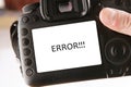 Back side of professional dslr digital photo camera with text error on screen Royalty Free Stock Photo