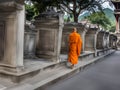 Back side of Senior monk walk in ancient temple