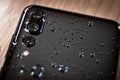 Back side of waterproof smartphone covered Royalty Free Stock Photo