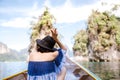 Back side of a woman sitting on long tail boat Royalty Free Stock Photo