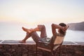 Back side of young man looking at the sea, vacations lifestyle concept