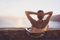 Back side of young man looking at the sea, vacations lifestyle concept Royalty Free Stock Photo