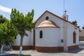 The back of a small beautiful red and white colored church Ekklisia Sotiros Christos Monastiri in Rethymno, Crete, Greece