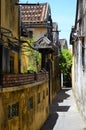 A back street in Hoi an, lined with old buildings. Royalty Free Stock Photo