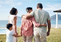 Back, summer and vacation by the sea with family outdoor together looking at a view of nature. Grandparents, mother and Royalty Free Stock Photo