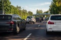 Back tail view of many cars stuck in row at highway city street road traffic jam. Automobile accident vehicle rush hour Royalty Free Stock Photo