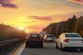 Back tail view of many cars stuck in row at highway city street road traffic jam warm sunset time. Automobile accident Royalty Free Stock Photo