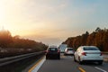 Back tail view of many cars stuck in row at highway city street road traffic jam warm sunset time. Automobile accident Royalty Free Stock Photo