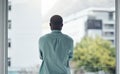 Back, thinking and window with a business black man standing in his office looking at a city view. Idea, motivation and Royalty Free Stock Photo